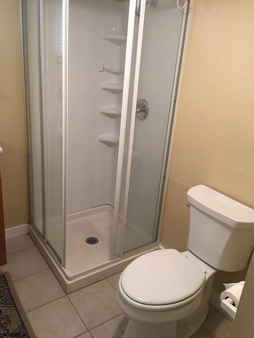 25 West Pierson Avenue Somers Point, NJ 08244 - Photo 5 of 6 a bathroom with a toilet and a shower