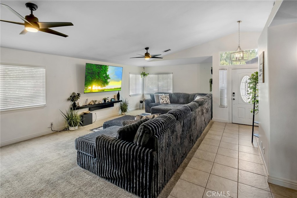 14952 Rivers Edge Road Helendale, CA 92342 - Photo 11 of 33 a living room with furniture a chandelier and a window