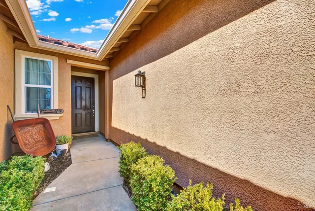 a view of a livingroom with furniture and a flat screen tv