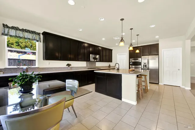 a bedroom with a bed window and couch