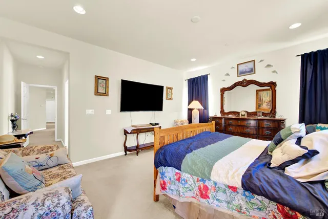 a bathroom with a sink double vanity and a mirror