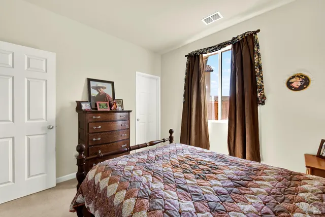 a bedroom with furniture and walk in closet