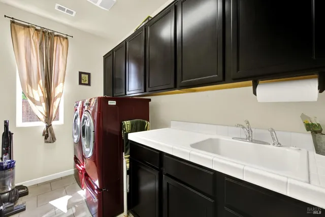 a view of a chairs and table in patio with a yard