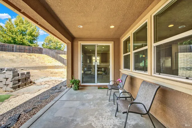 a view of a yard with snow on the road