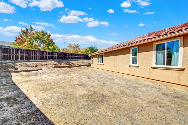 an aerial view of a house with a lake view