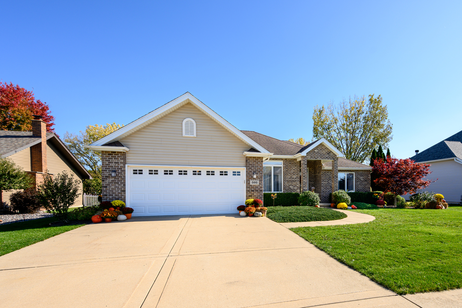 592 South Walnut Street Manteno, IL 60950 - Photo 2 of 37 a front view of a house with a yard