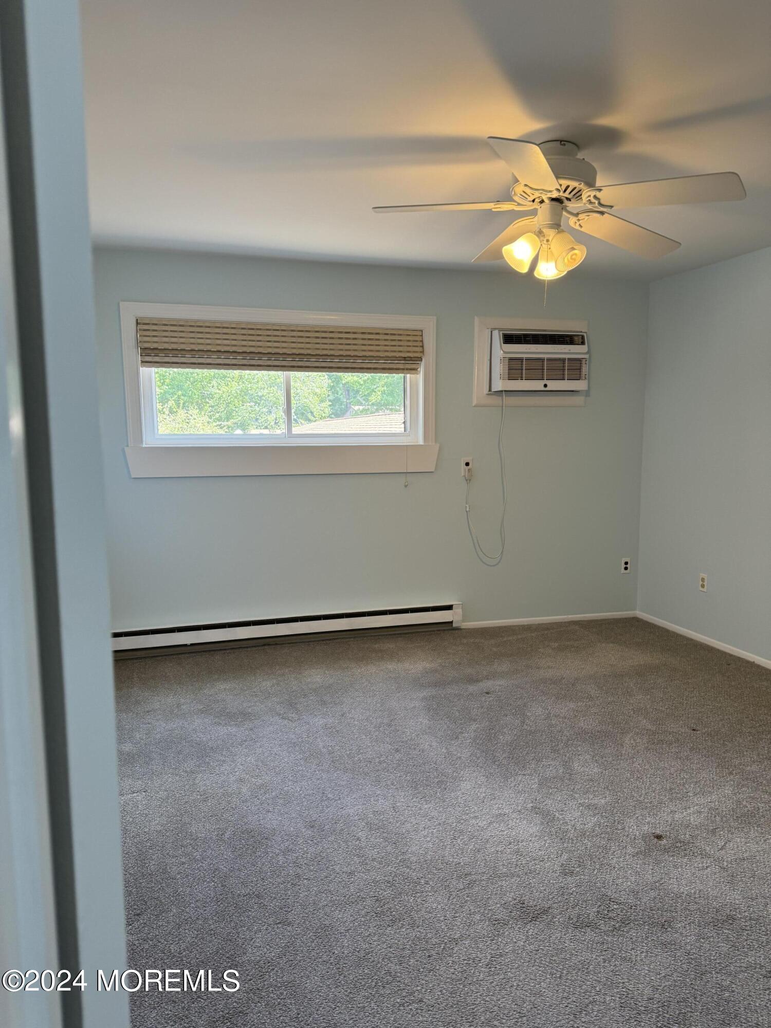 95 Lexington Court Red Bank, NJ 07701 - Photo 13 of 26 a view of an empty room and window
