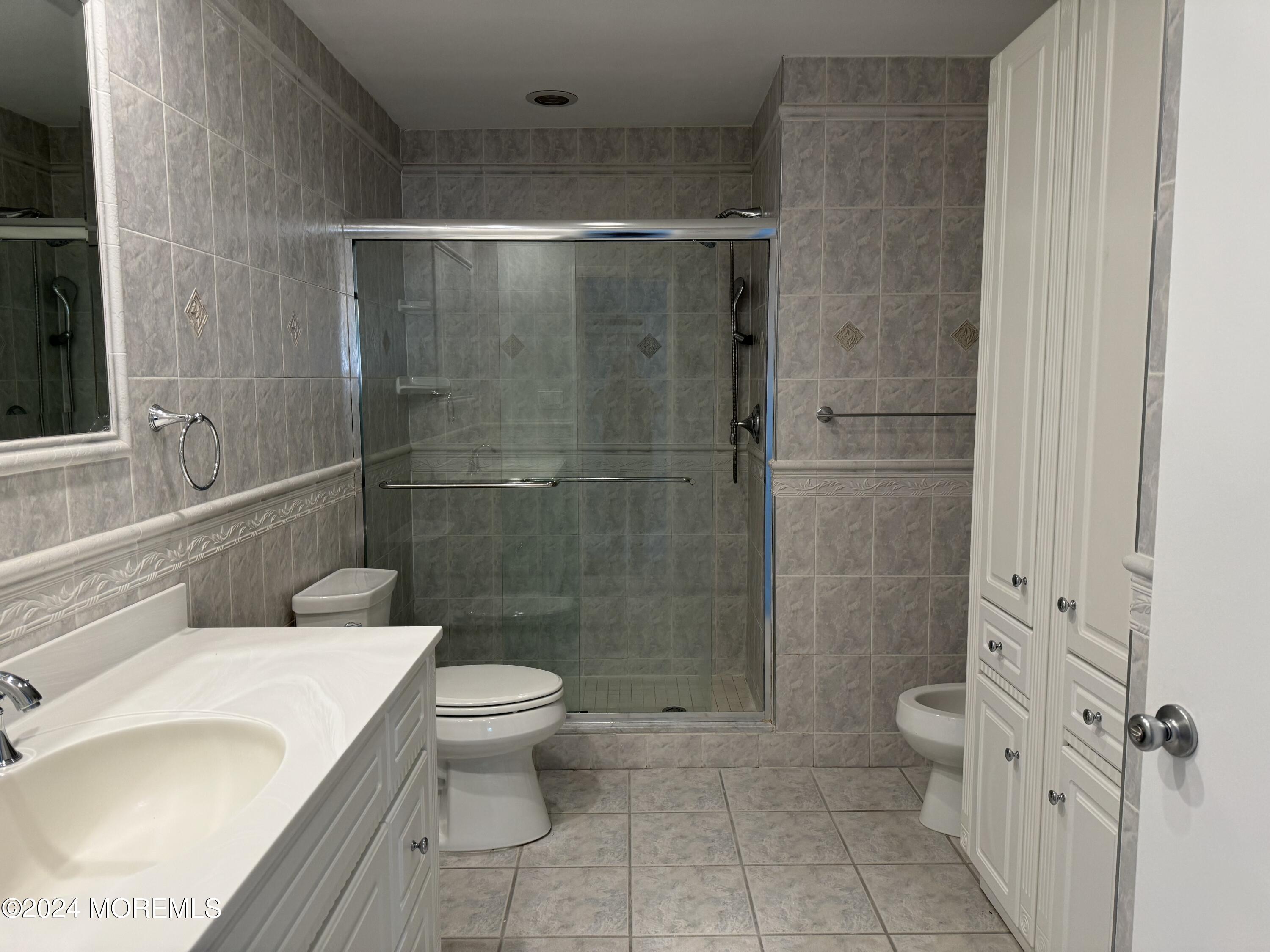 95 Lexington Court Red Bank, NJ 07701 - Photo 17 of 26 a bathroom with a toilet a sink and shower