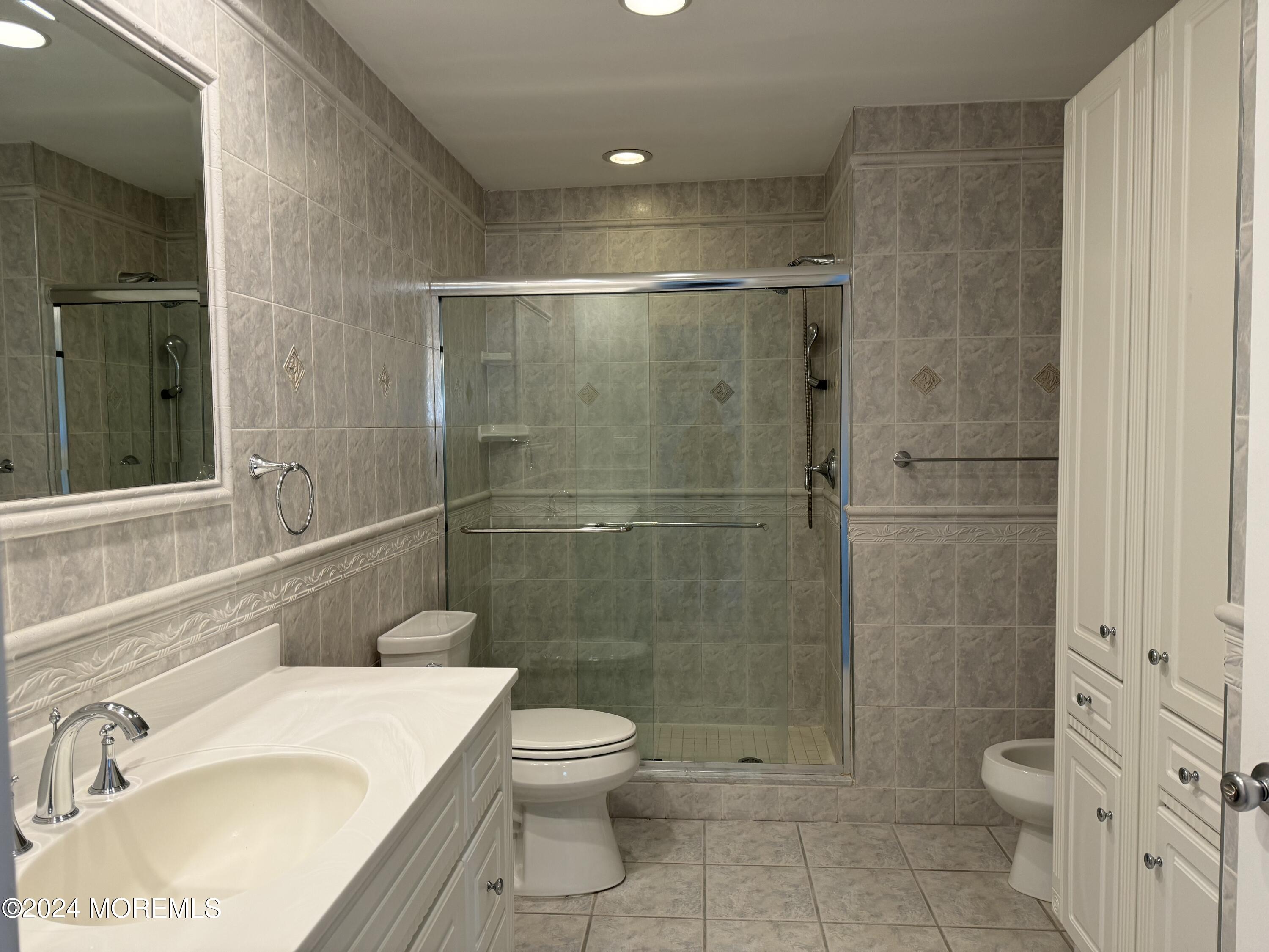95 Lexington Court Red Bank, NJ 07701 - Photo 17 of 26 a bathroom with a sink toilet and shower