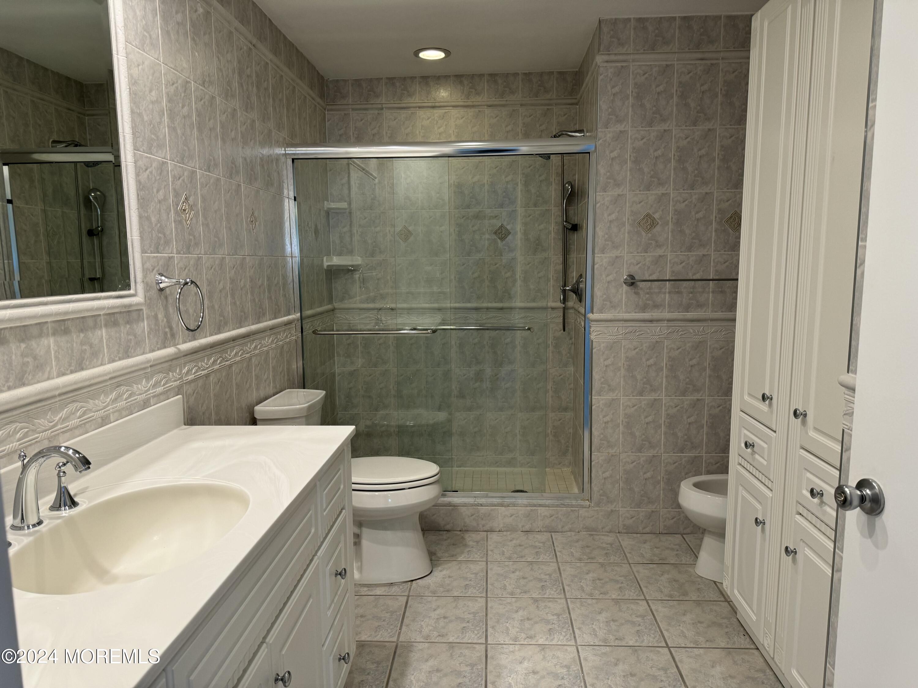 95 Lexington Court Red Bank, NJ 07701 - Photo 18 of 26 a bathroom with a sink toilet and shower