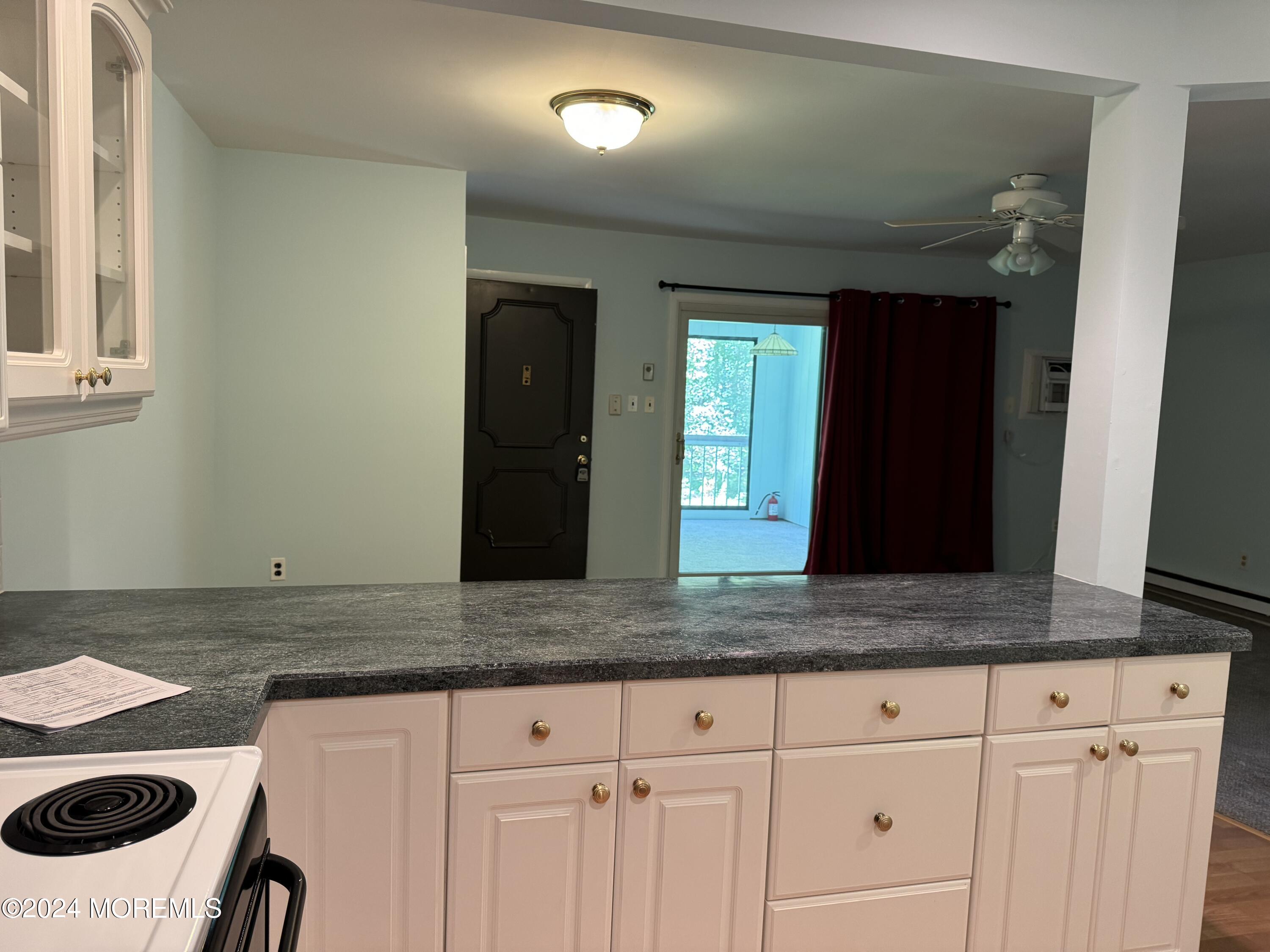 95 Lexington Court Red Bank, NJ 07701 - Photo 7 of 26 a view of a kitchen counter space and a sink