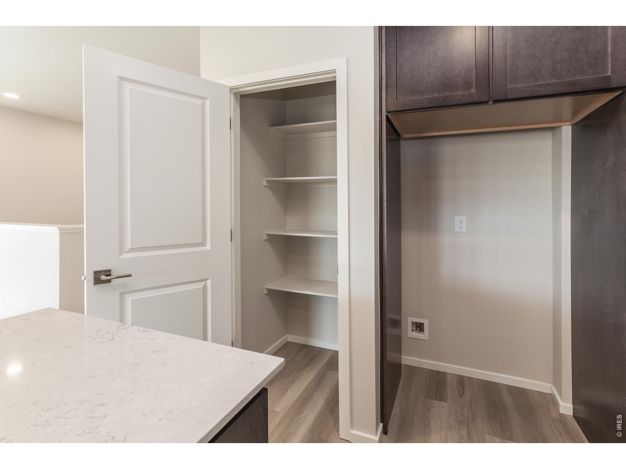 792 Chatter Road Windsor, CO 80550 - Photo 21 of 49 a bedroom with a bed and a cabinets
