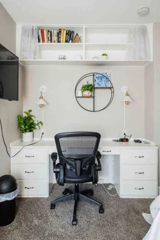 a bathroom with a toilet and a view of bathroom