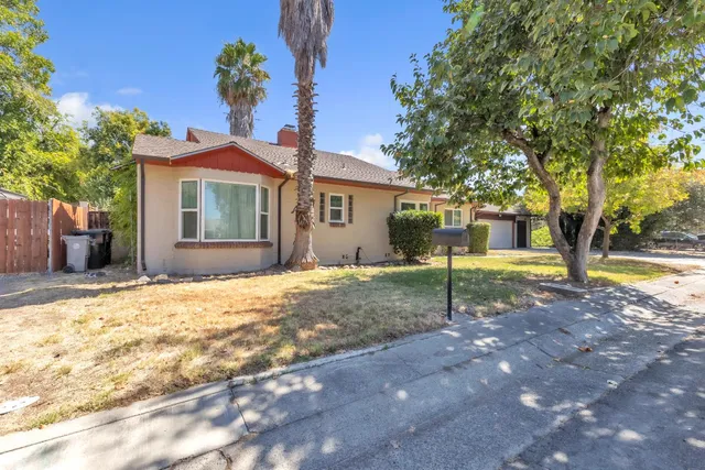 a house with a tree in front of it