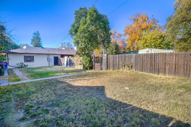 an aerial view of a house with a swimming pool