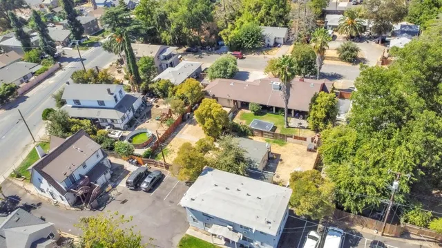 an aerial view of a house with a yard