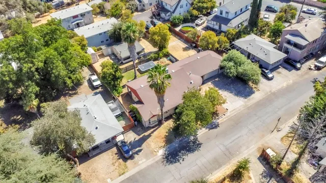 an aerial view of a house with a yard