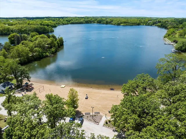 a view of a lake with a flower in a garden