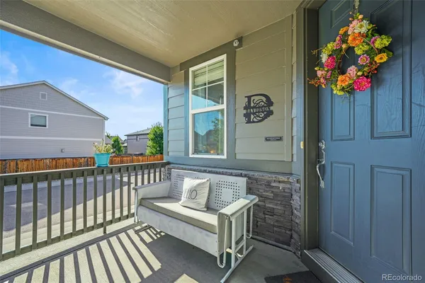 a view of a porch with furniture