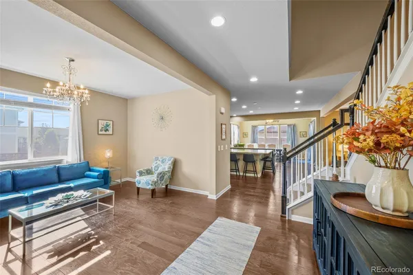 a living room with furniture and a table