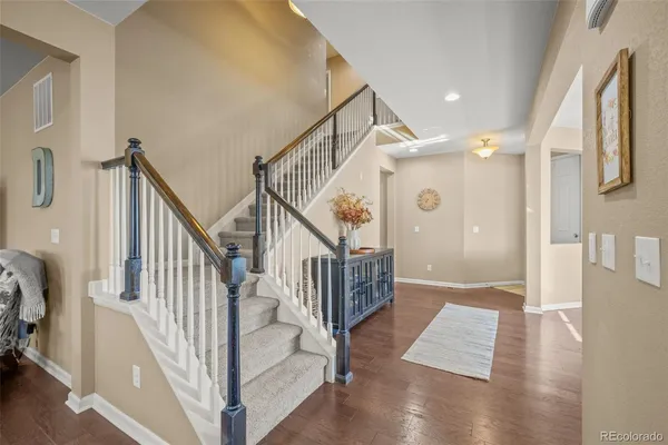 a view of entryway with wooden floor