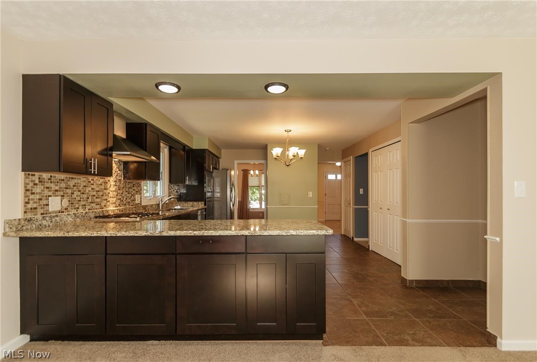 5590 Ridgebury Boulevard Lyndhurst, OH 44124 - Photo 6 of 25 The family in the gathering room while the Chef is busy.