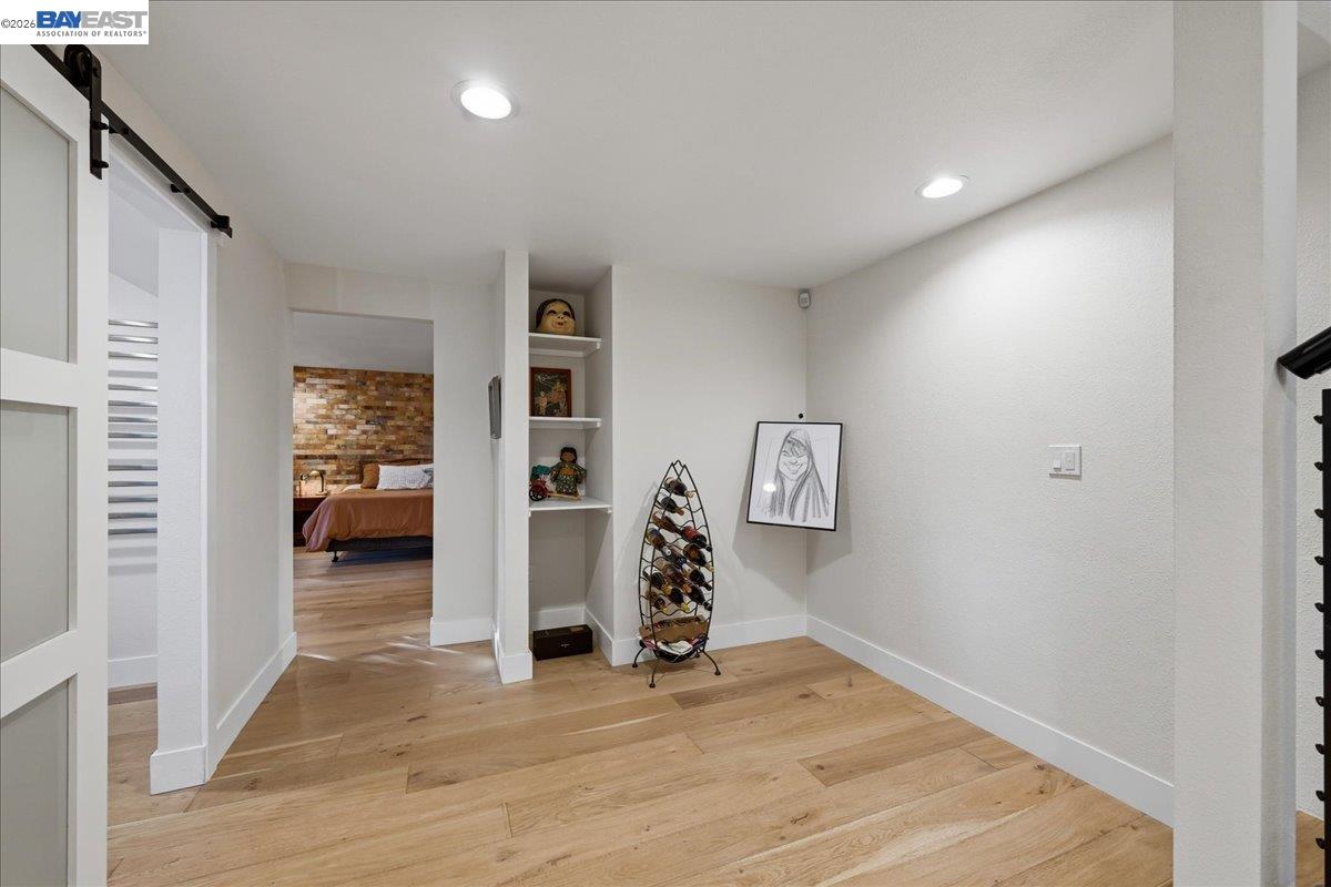 22111 Prospect Street Hayward, CA 94541 - Photo 39 of 70 a view of a hallway with wooden floor and windows