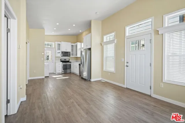 a view of a kitchen with a stove cabinets and wooden floor
