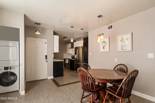a view of a dining room with furniture and wooden floor