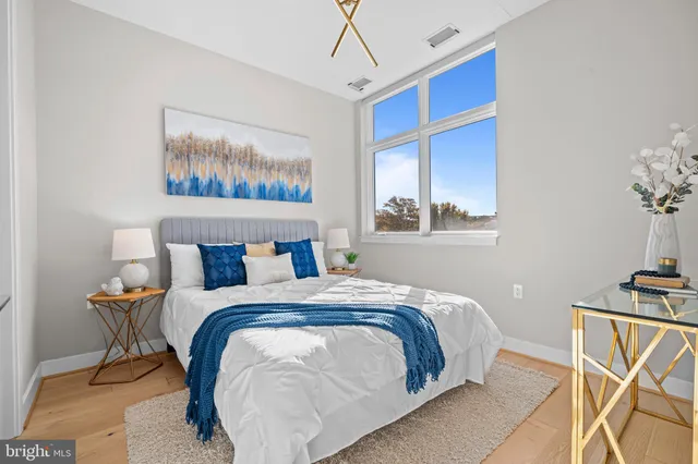 a bedroom with bed and window