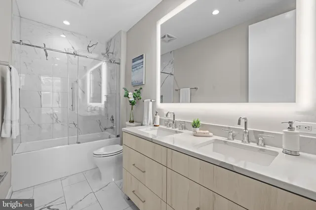 a view of a hallway with washer and dryer