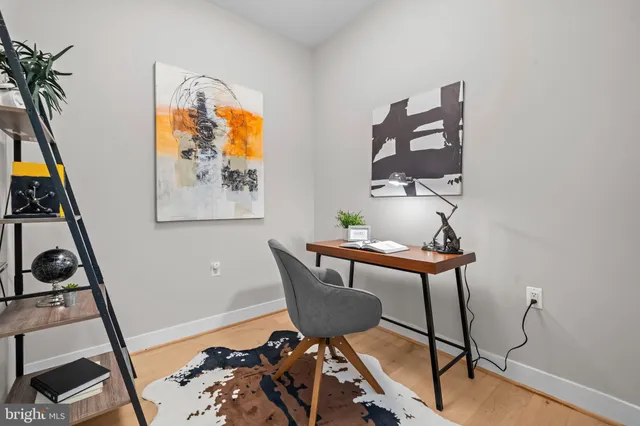 a workspace with furniture and wooden floor