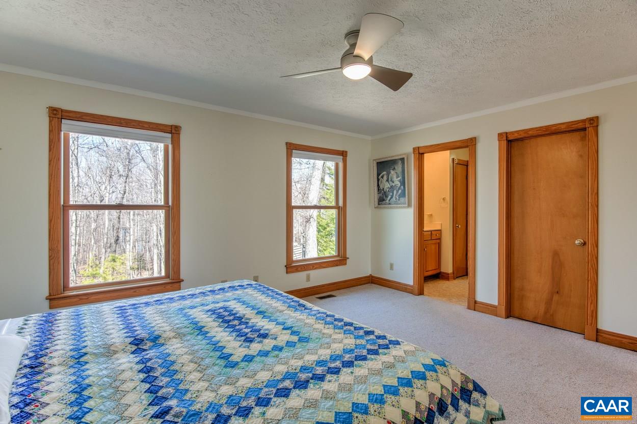 87 Laguna Road Palmyra, VA 22963 - Photo 19 of 38 a bedroom with a bed and a window