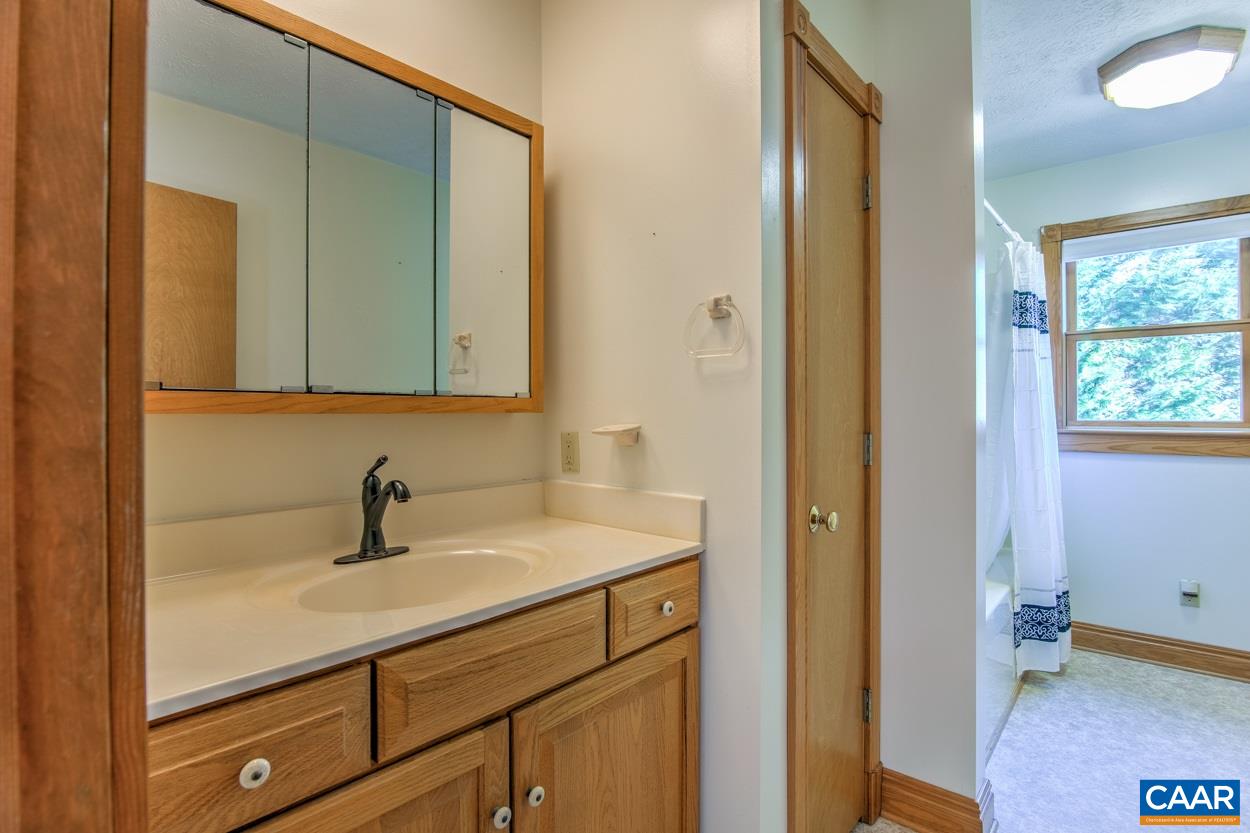 87 Laguna Road Palmyra, VA 22963 - Photo 20 of 38 a bathroom with a sink and a mirror