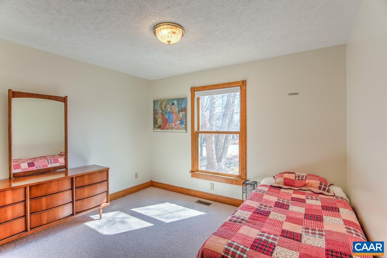 87 Laguna Road Palmyra, VA 22963 - Photo 23 of 38 a bedroom with a bed and a window
