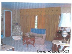 110 Market Street Moscow, PA 18444 - Photo 3 of 5 a living room with furniture and a rug