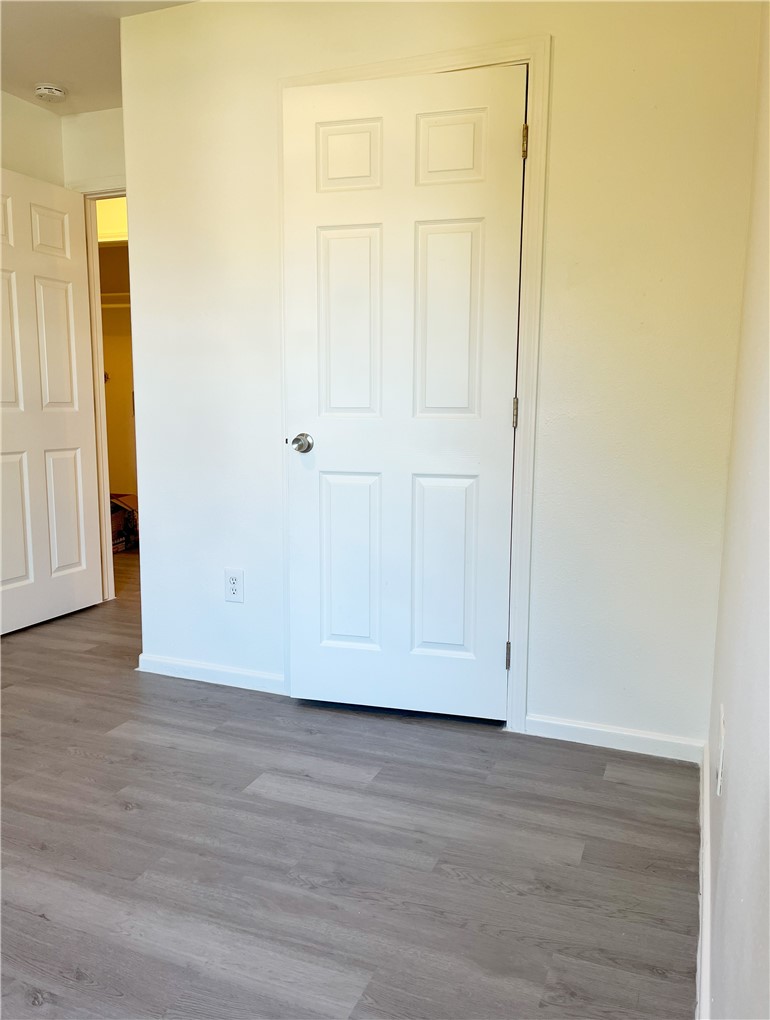 1802 16th Street, Unit B Corpus Christi, TX 78404 - Photo 13 of 17 an empty room with wooden floor