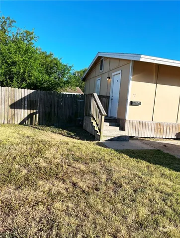 a view of a backyard with a garden