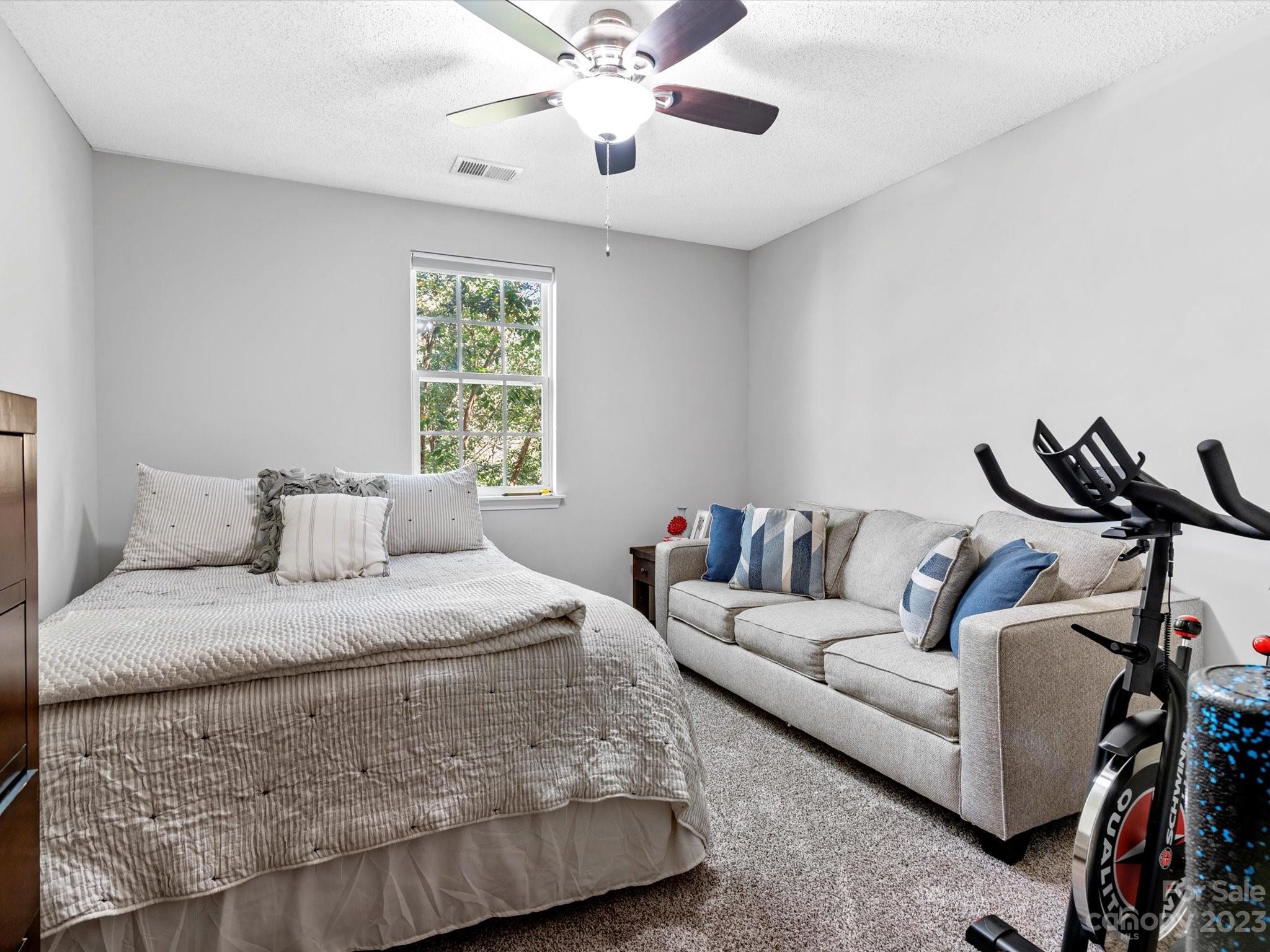 8162 Rudolph Road Charlotte, NC 28216 - Photo 14 of 17 a living room with furniture and a window