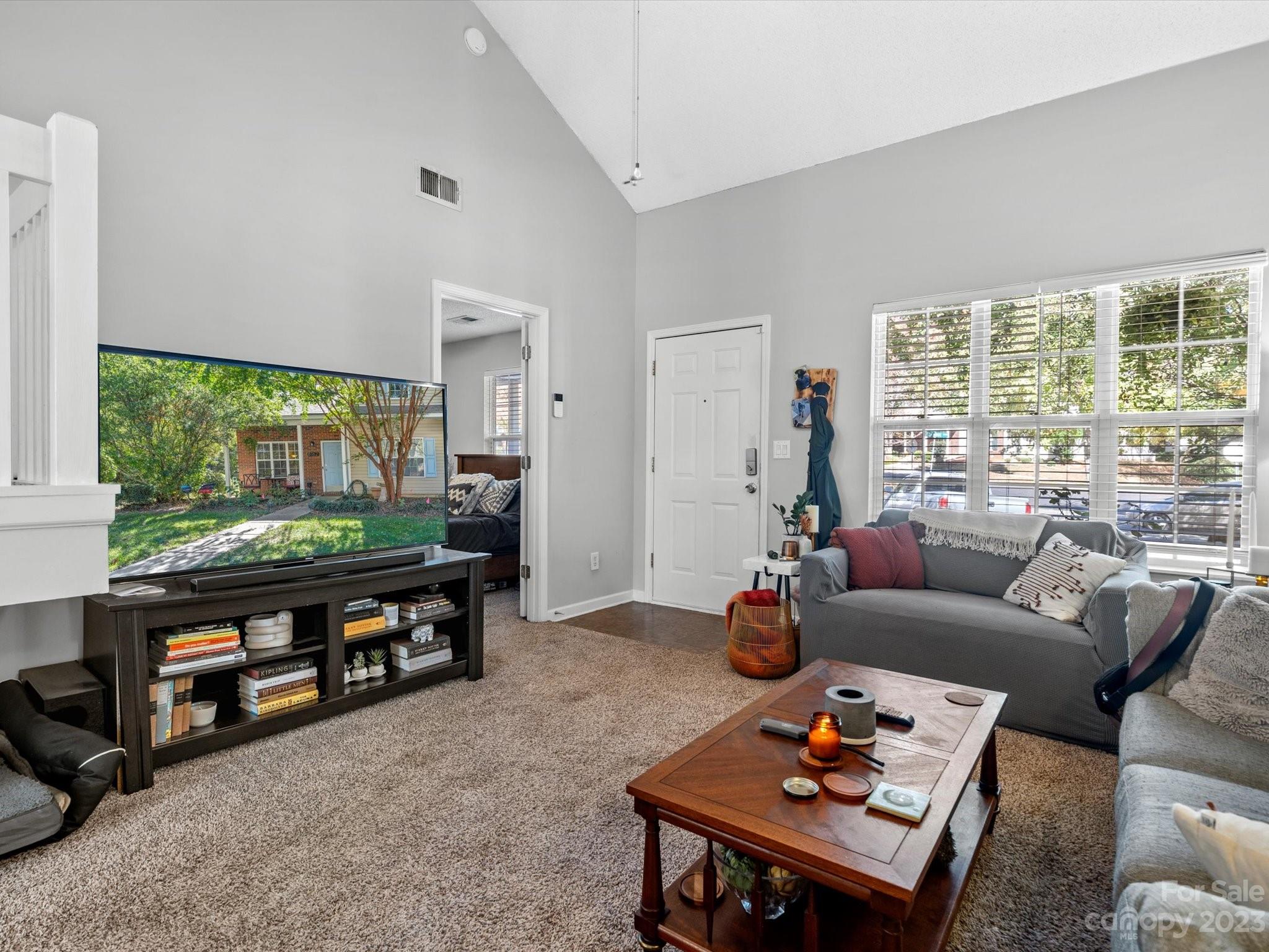 8162 Rudolph Road Charlotte, NC 28216 - Photo 6 of 17 a living room with furniture and a large window