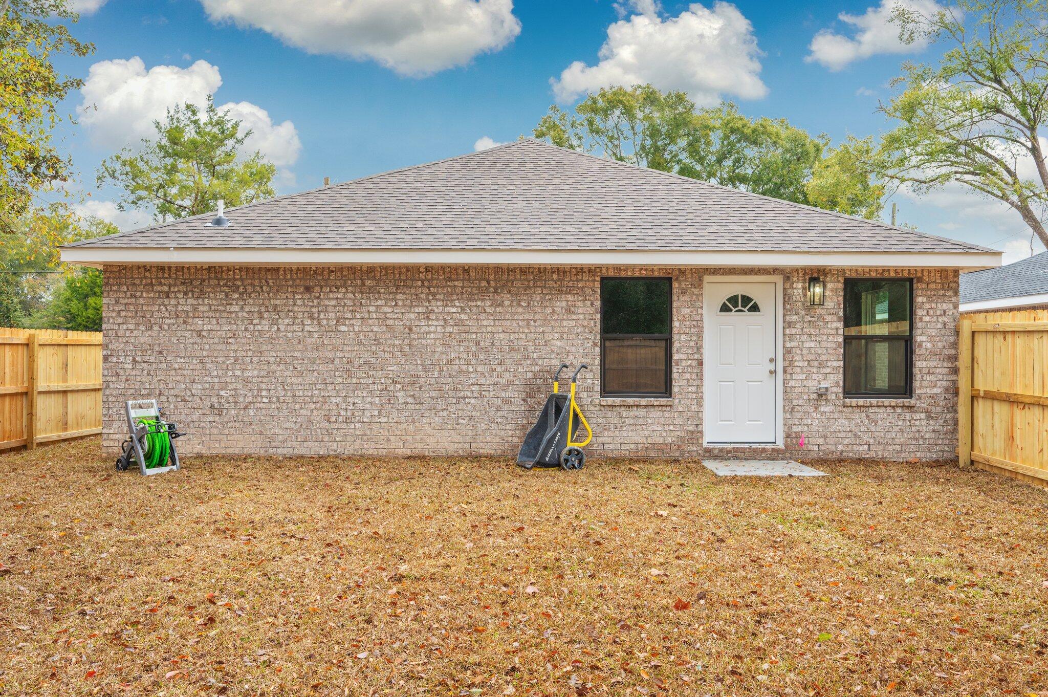 609 East Chestnut Avenue Crestview, FL 32539 - Photo 26 of 31 a view of a house with a yard