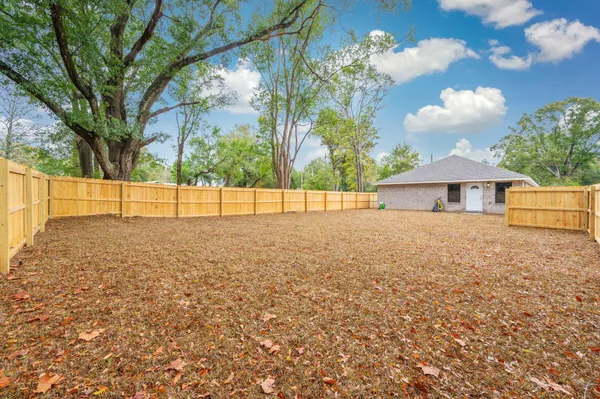 a view of backyard with a garden and outdoor seating