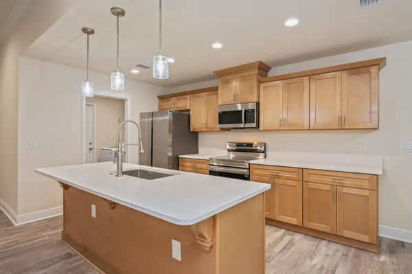 a view of kitchen with wooden floor and window