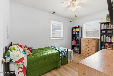 a bedroom with a bed and furniture