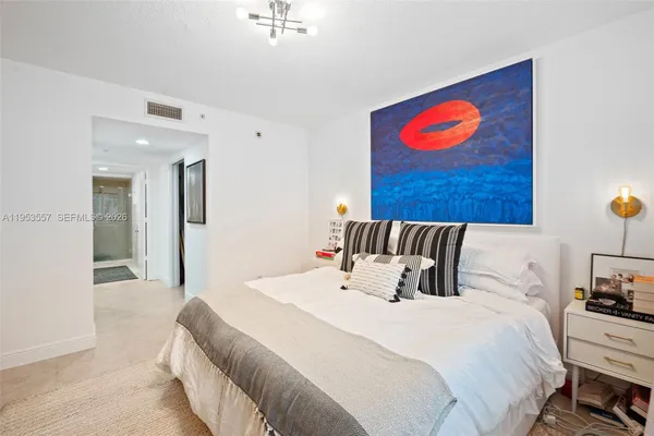 a bedroom with a bed and cupboard