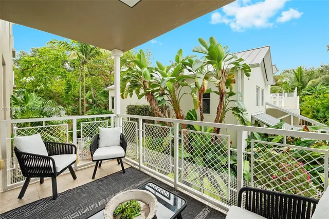 a balcony with chairs