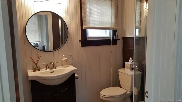 a bathroom with a shower and toilet