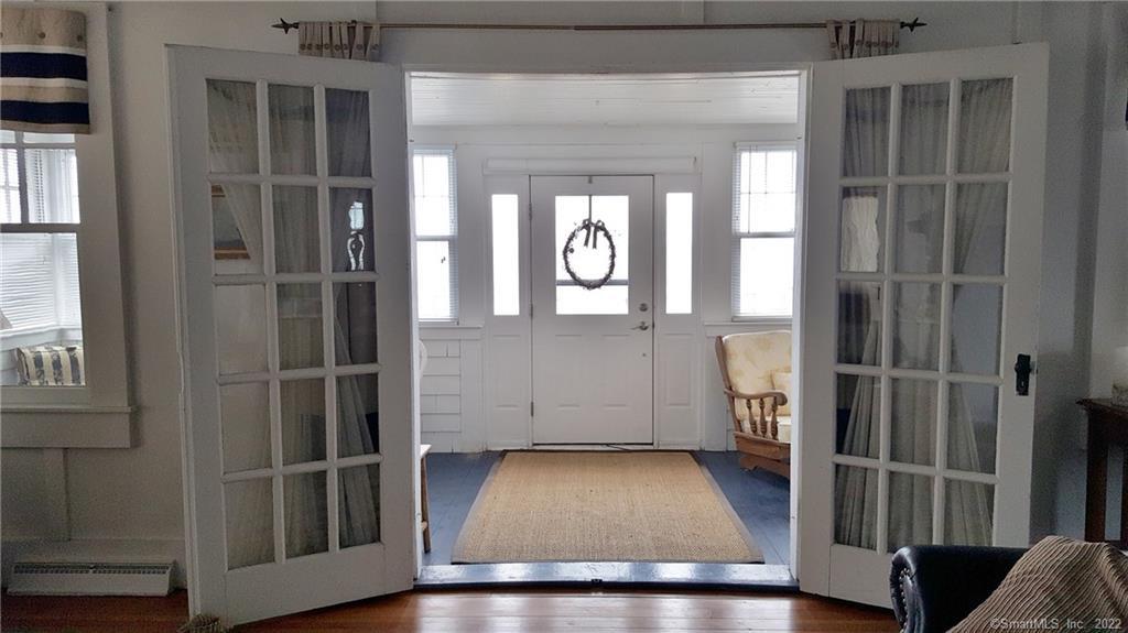 422 Maple Avenue Old Saybrook, CT 06475 - Photo 17 of 32 French doors to Enclosed porch