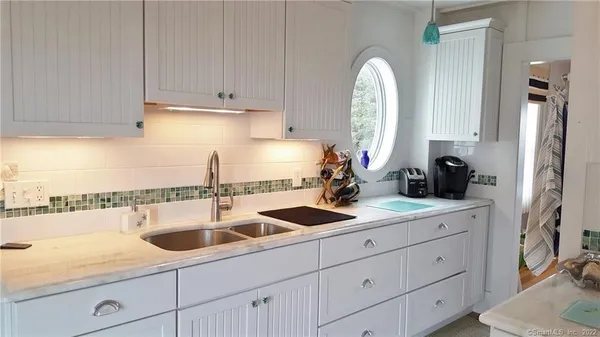 a kitchen with a cabinets and a stove