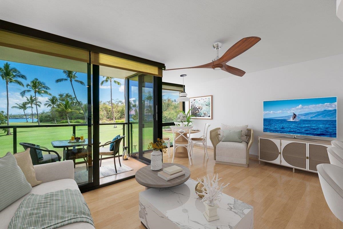 a living room with furniture and a floor to ceiling window